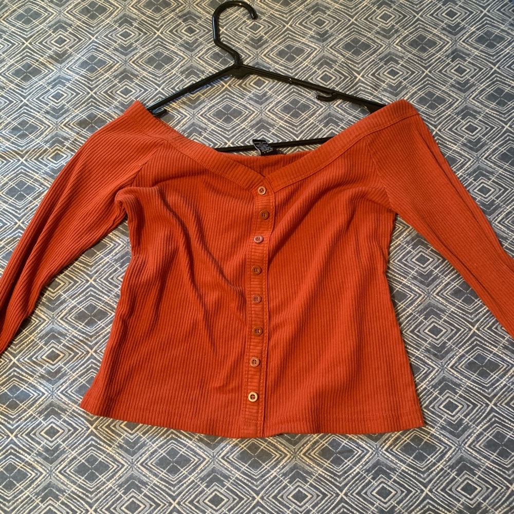 An off the shoulder shirt.